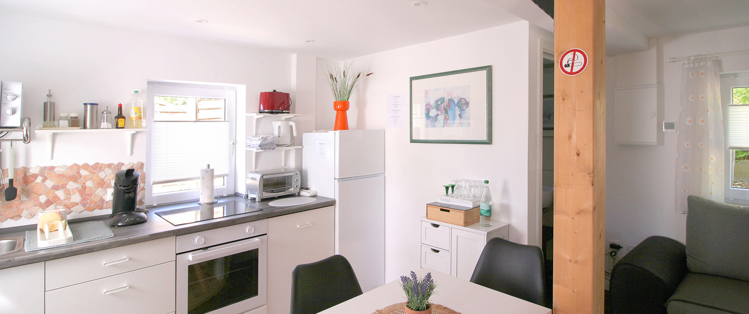 Wohnbereich mit Küche Wohnbereich mit Küche des Ferienhauses Patsada-Cottage in Wiehl bei Gummersbach